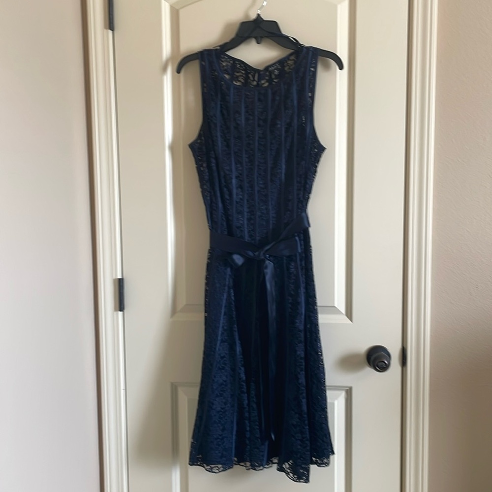 SLNY sleeveless dress with sheer cardigan.